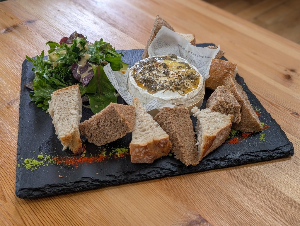 Baked cheese and bread platter